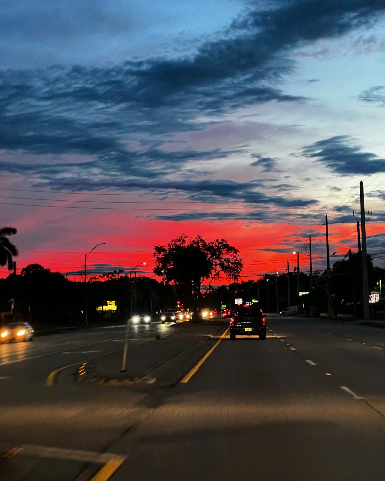 Florida road at golden sunset hour with warm sky